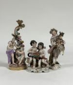 A group of 19th century Continental porcelain figures comprising: a Meissen figural candlestick (