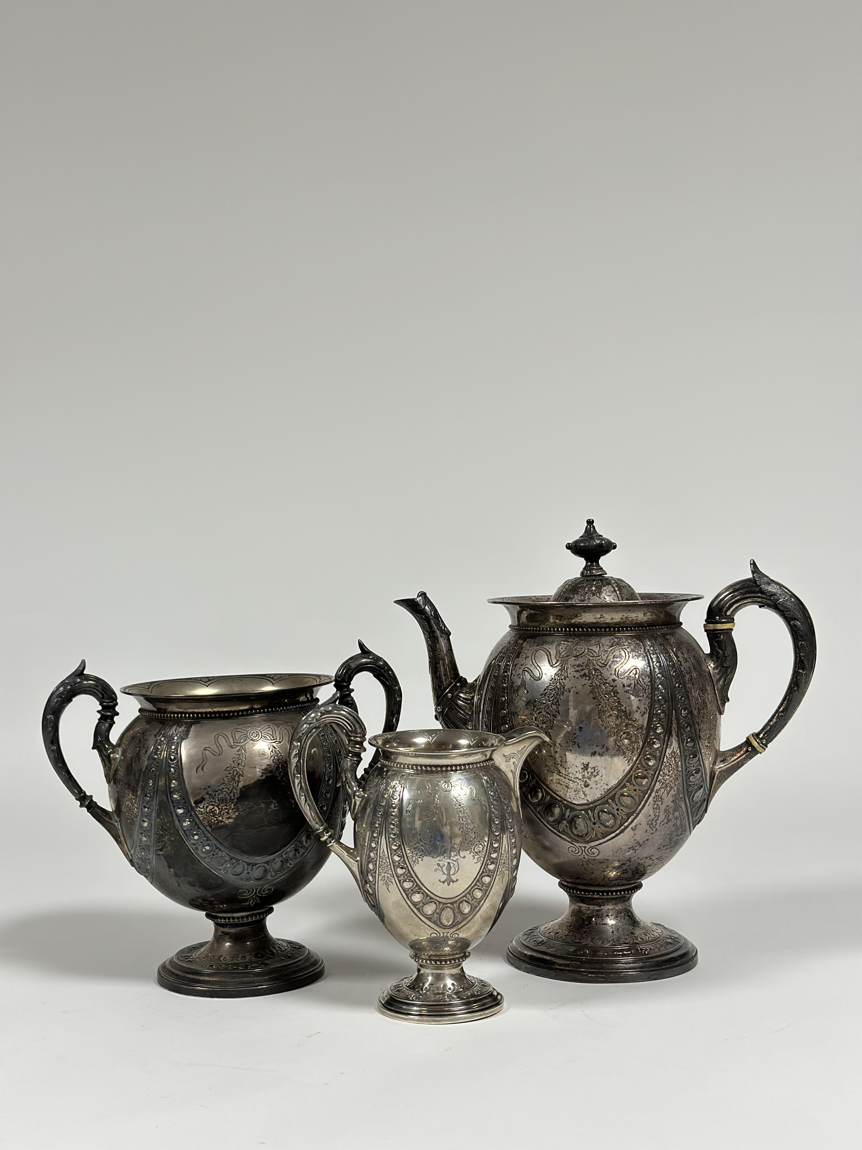 A Victorian three piece silver tea service, Alexander Crichton, London 1875, each piece of shaped