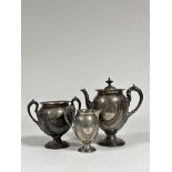 A Victorian three piece silver tea service, Alexander Crichton, London 1875, each piece of shaped