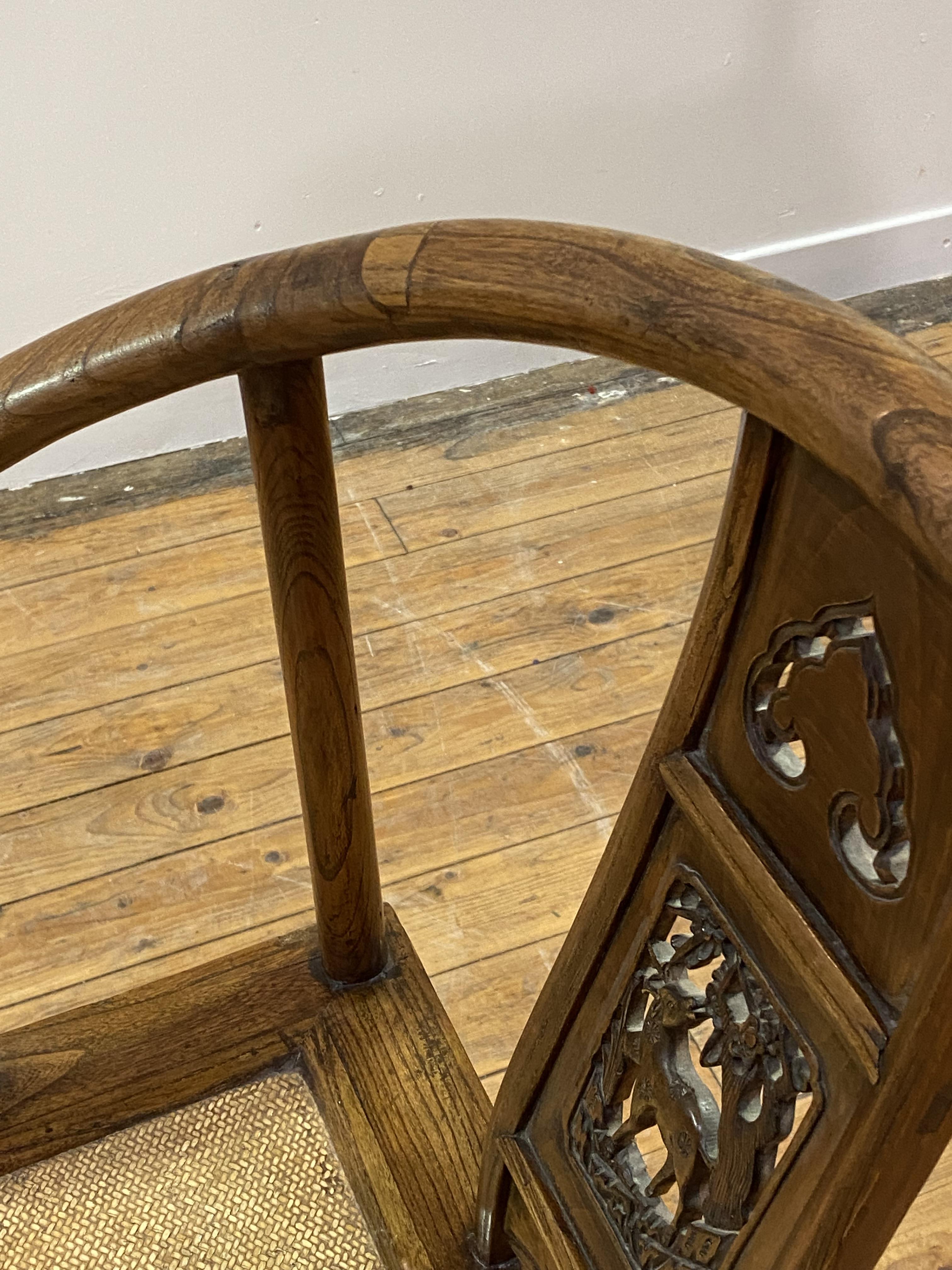 A Chinese elm horseshoe back chair, late 19th/ early 20th century, the sweeping crest rail with - Image 5 of 6