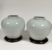 A pair of Chinese heavily potted monochrome glazed porcelain jars, in a clair de lune or bluish