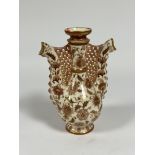 Zsolnay Pecs: a "Persian" twin spout ewer, in pink and gilt, blue printed marks. Height 29cm (