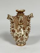 Zsolnay Pecs: a "Persian" twin spout ewer, in pink and gilt, blue printed marks. Height 29cm (