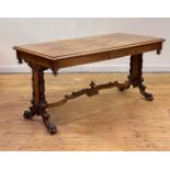 A fine Dutch walnut library table, 19th century, the cross banded top with radial circular and