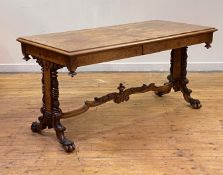 A fine Dutch walnut library table, 19th century, the cross banded top with radial circular and