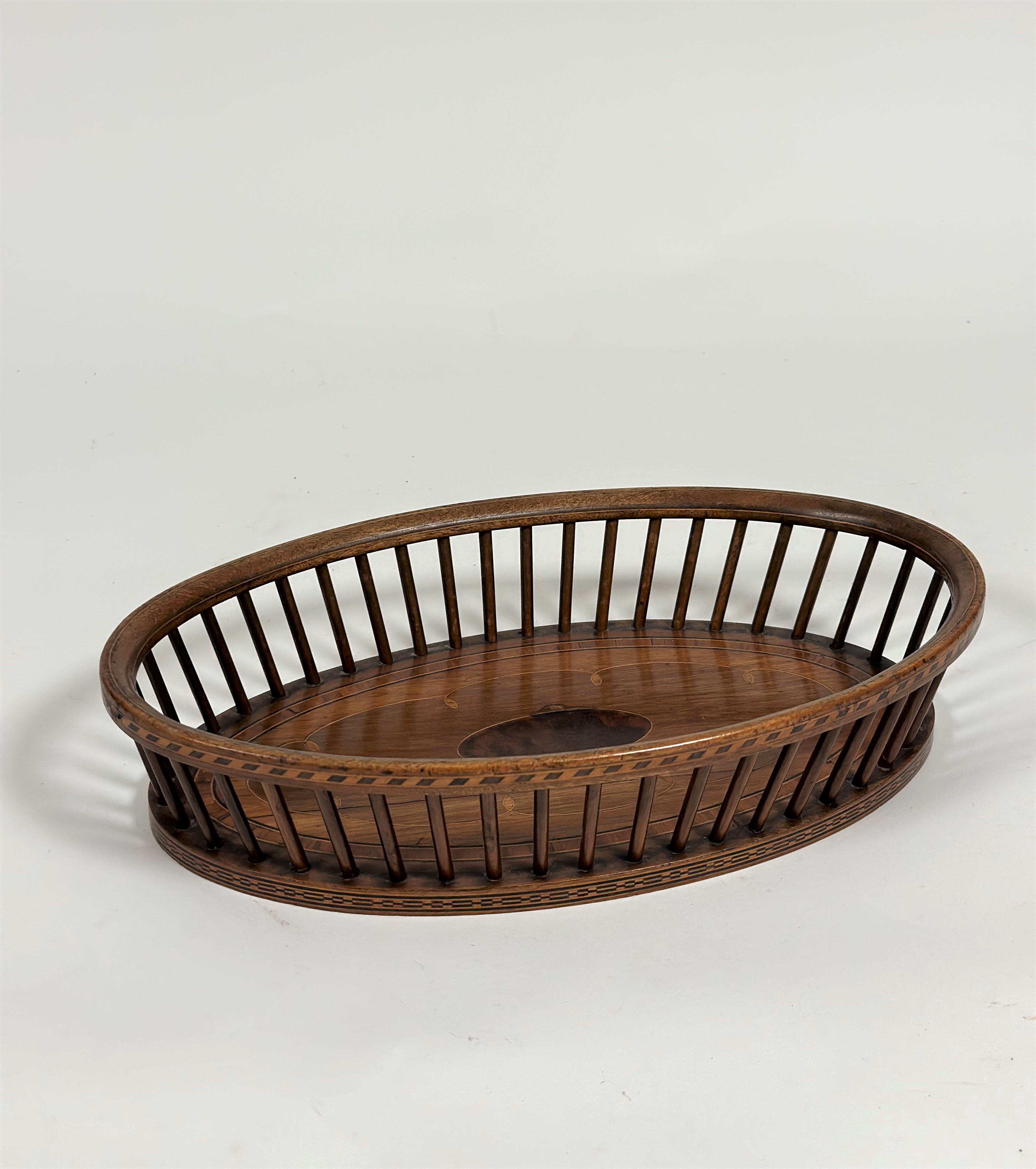 A satinwood-inlaid mahogany bread basket, of Georgian design, early 20th century, oval, the base