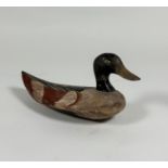 Folk Art: a painted wooden decoy duck, with red-tipped wings. Length 30.5cm