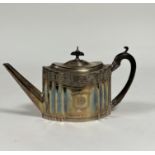 A George III silver teapot, Charles Aldridge, London 1793, oval, with bright-cut decoration, further