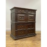 An oak chest of drawers, early 17th century and later, the top with moulded edge over four panel