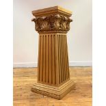 A carved beech plinth of Classical design, the square moulded and acanthus-carved capital over