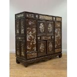 A fine Chinese rosewood, fruitwood and mother of pearl inlaid cabinet, 19th century, the panelled