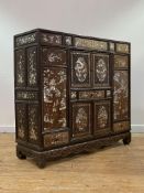 A fine Chinese rosewood, fruitwood and mother of pearl inlaid cabinet, 19th century, the panelled