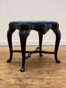 A lacquered Chinoiserie stool of serpentine outline, circa 1920, the top upholstered in