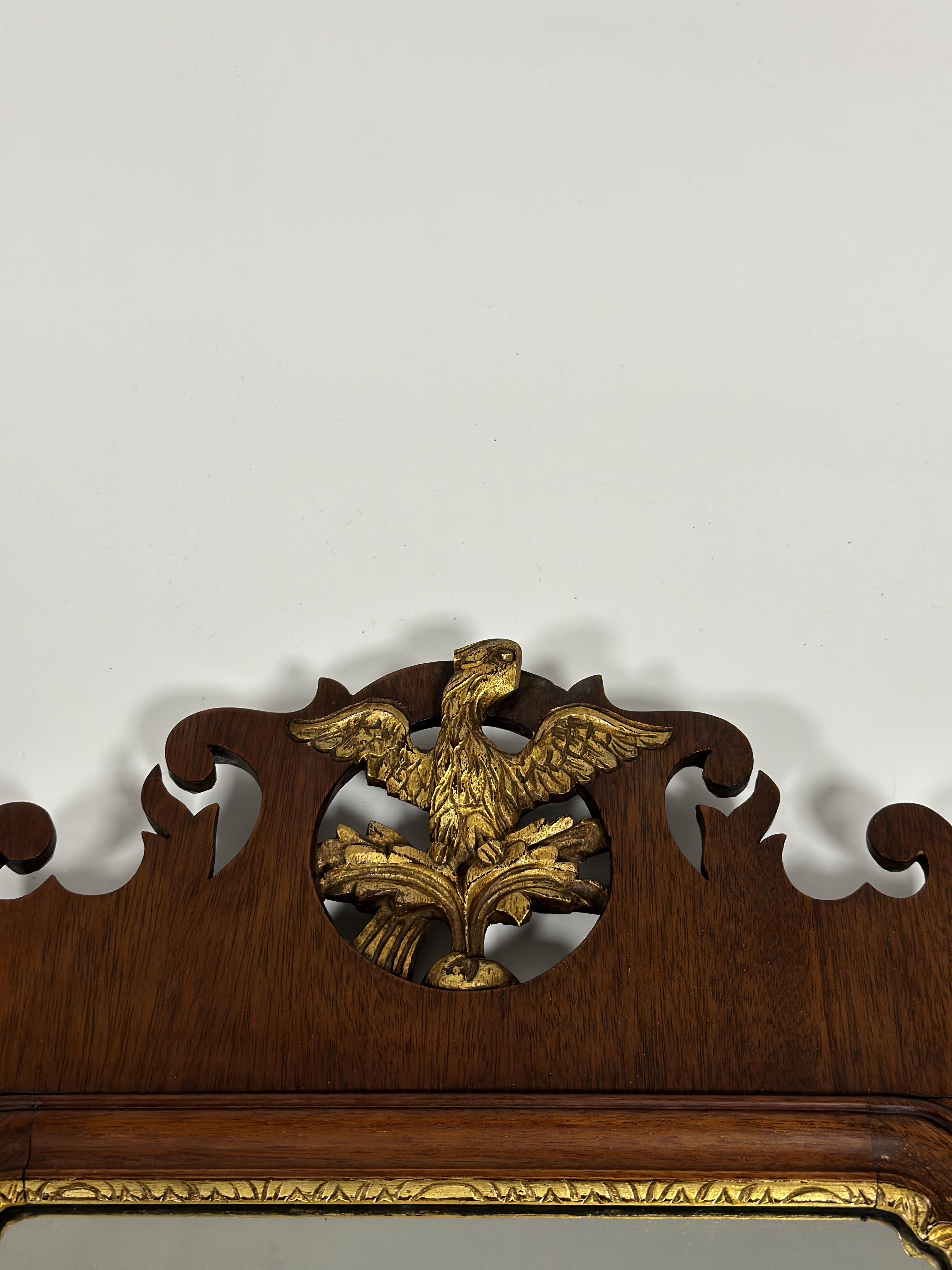 A George III style parcel-gilt walnut fretwork mirror, with ho-ho bird crest. Overall 71cm by 39cm - Image 2 of 2