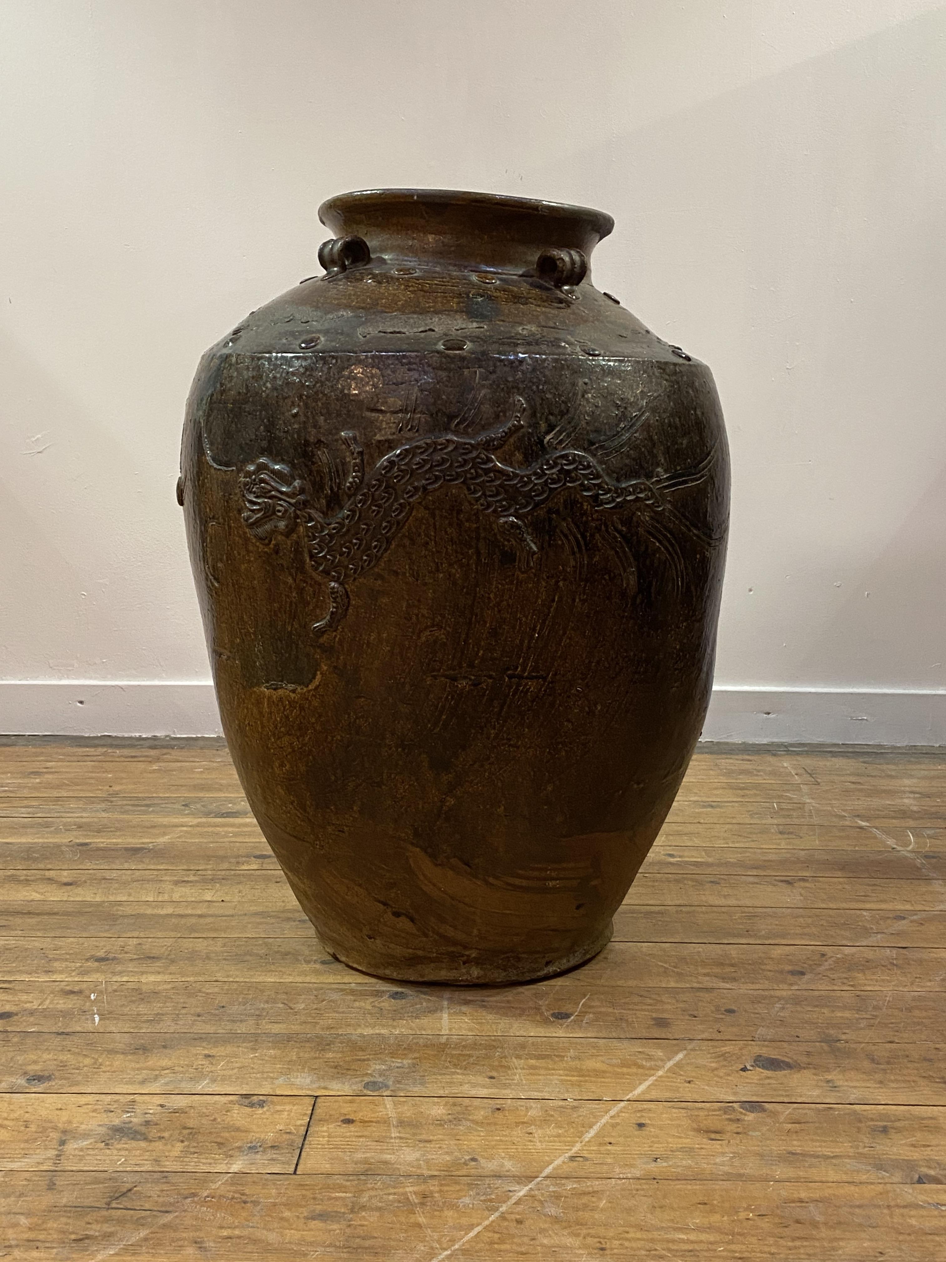 A large Chinese brown-glazed Martaban jar, probably 19th century, the tapering ovoid body