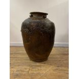 A large Chinese brown-glazed Martaban jar, probably 19th century, the tapering ovoid body