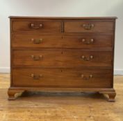 A George III mahogany chest of drawers, the rectangular top with moulded edge over two short and