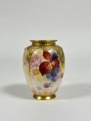 A Royal Worcester fruit-painted vase by Kitty Blake, decorated with blackberries and autumn foliage,