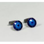 A pair of German silver and engine-turned enamel cufflinks, circular, with bands of blue and