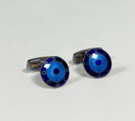 A pair of German silver and engine-turned enamel cufflinks, circular, with bands of blue and