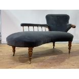 An early Victorian rosewood framed chaise longue of serpentine outline, the deep buttoned spoon back