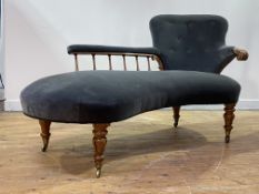 An early Victorian rosewood framed chaise longue of serpentine outline, the deep buttoned spoon back