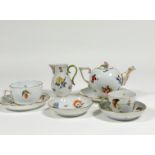 A Herend Vegetable pattern partial tea service comprising: teapot with floral knop; cream jug;