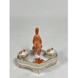 A Herend porcelain inkstand in the Chinese Bouquet (rust) pattern, the double wells each with