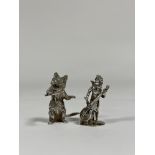 Two silver miniature models: a cat wielding a conductor's baton, Hamilton & Inches, London 2007; and