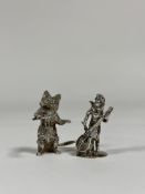Two silver miniature models: a cat wielding a conductor's baton, Hamilton & Inches, London 2007; and