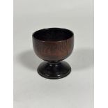 A 19th century turned treen goblet (crack to bowl). Height 9.5cm