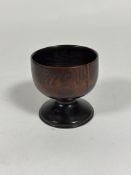 A 19th century turned treen goblet (crack to bowl). Height 9.5cm