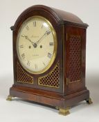 A Regency bracket clock by Mitchelson of London, the domed mahogany case with brass fish scale