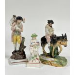 A group of early 19th century Staffordshire figures comprising: a pearlware figure emblematic of