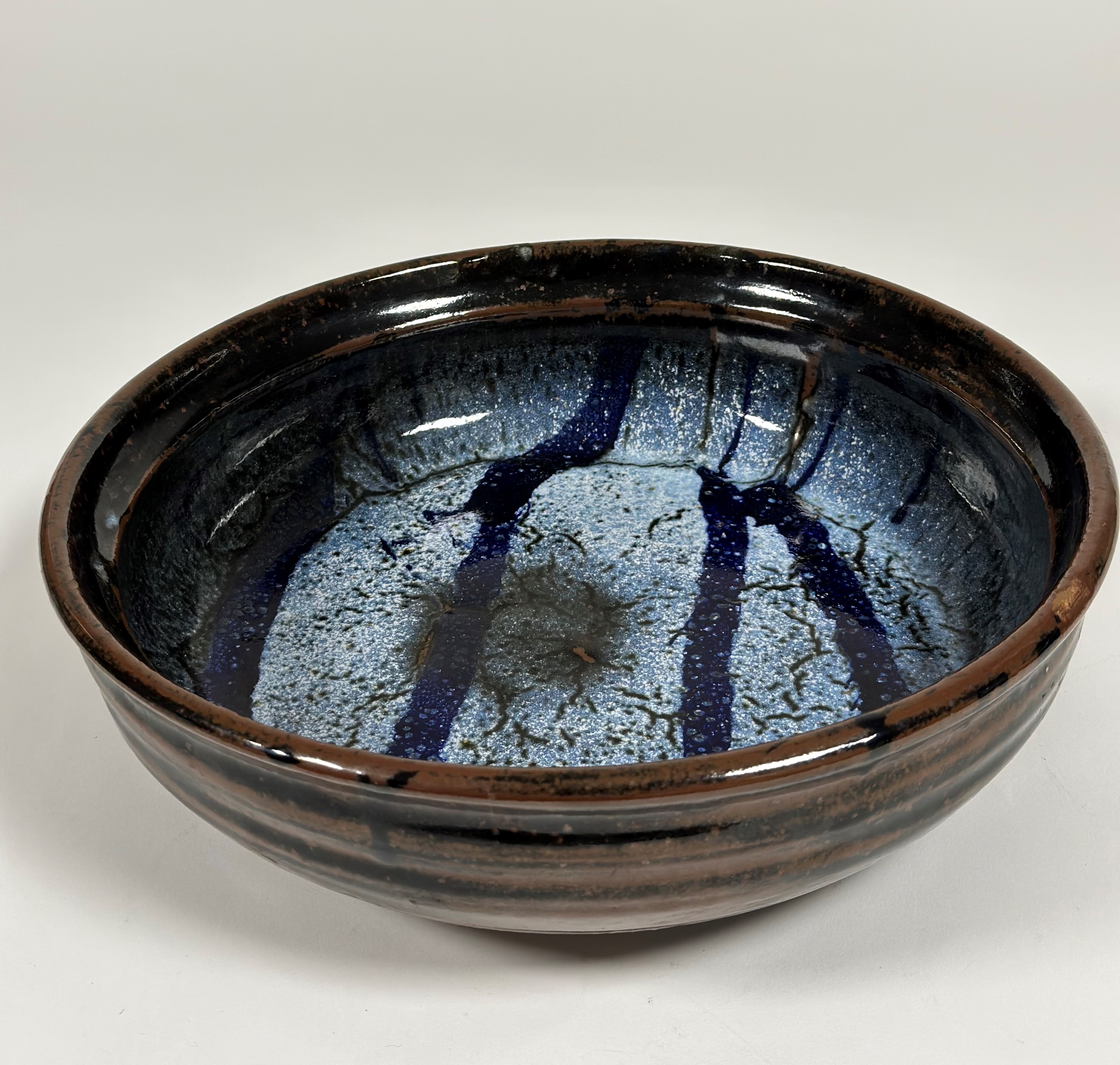 Trevor Corser (British, 1938-2015), for Leach Pottery, a large shallow stoneware bowl, the well in