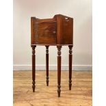 A late George III mahogany bow front night commode or bedside table, the tray top with pierced