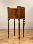 A late George III mahogany bow front night commode or bedside table, the tray top with pierced