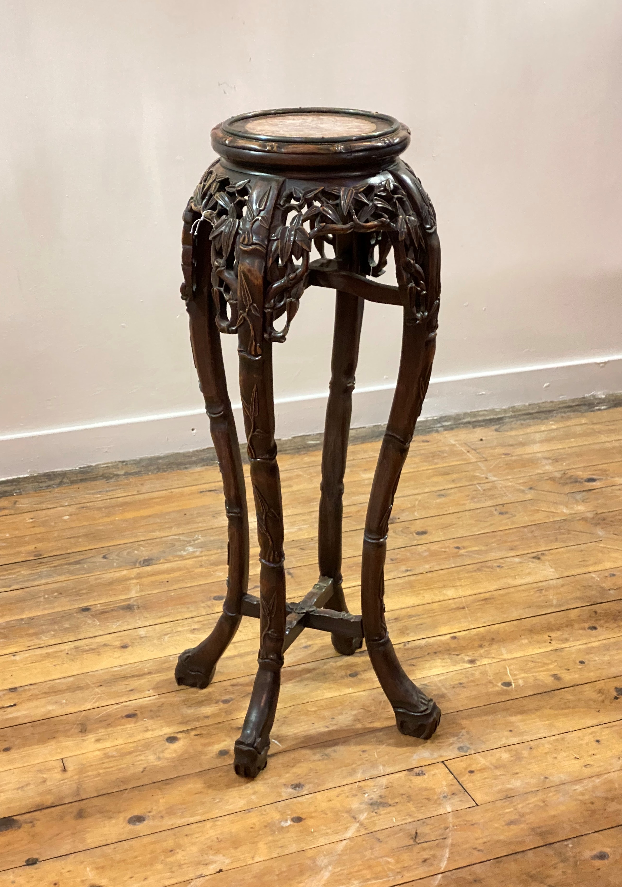 A Chinese hardwood jardiniere stand, early 20th century, the circular top inset with Breche Violette