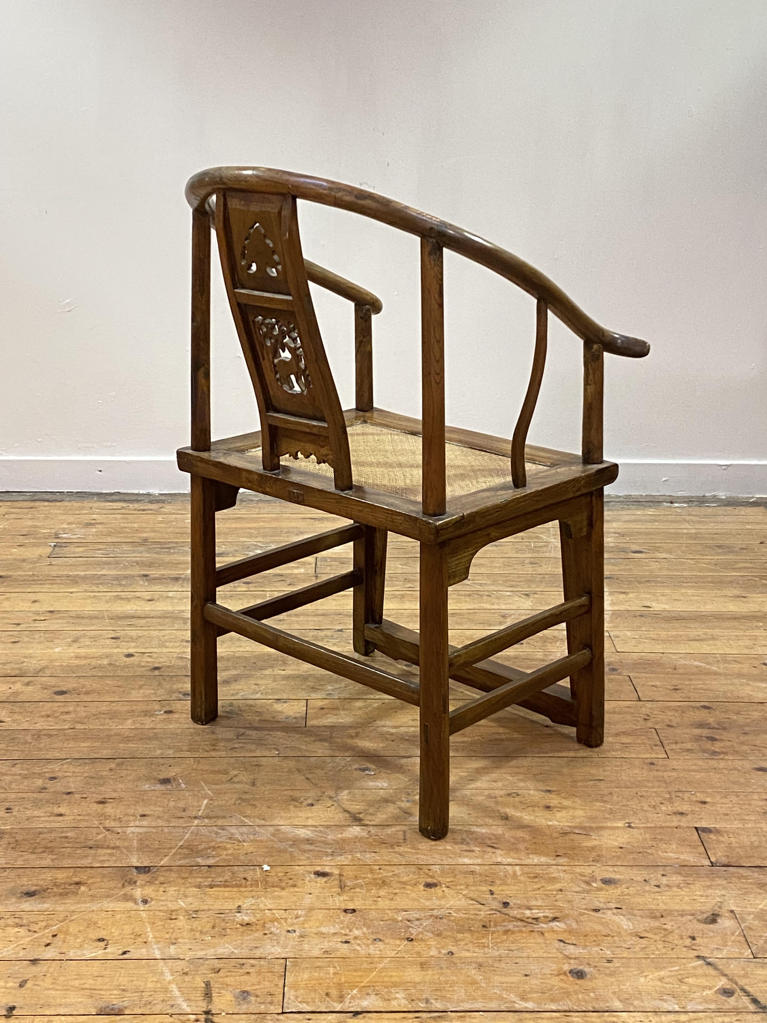 A Chinese elm horseshoe back chair, late 19th/ early 20th century, the sweeping crest rail with - Image 3 of 6