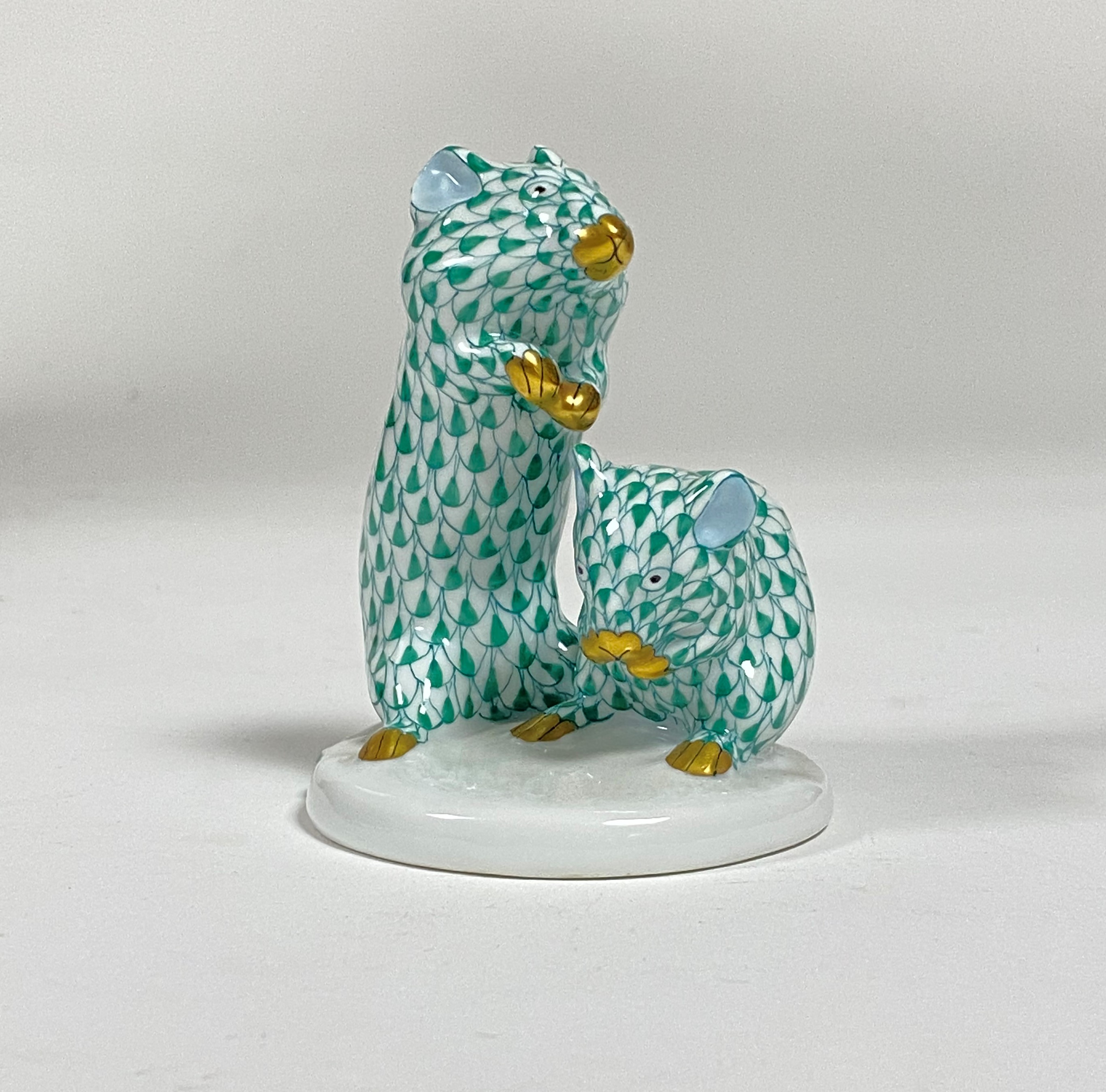 A Herend group of two mice, in the green fishnet pattern, printed mark. Height 8cm