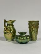 Zsolnay Pecs: a group in eosin gold/green glazes comprising a jug modelled with figures; a beaker-