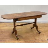 A Regency rosewood sofa table, the cross banded top with drop leaf to each end, over frieze having