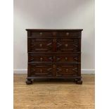 An oak two part chest of drawers, circa 1700 and later, the rectangular top with moulded edge over