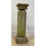 A Carved stone pedestal column of square geometric form, together with a fluted stone column H103cm