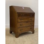 An Edwardian mahogany bureau, the fall front revealing fitted interior over four graduated drawer,