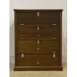 An early 20th century mahogany chest, moulded top over four fall front cupboards, skirted base (