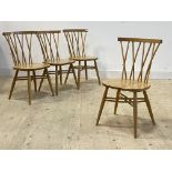 Ercol, A set of sour oak crossed comb back dining chairs, on turned supports with double 'X'