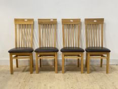 A set of four contemporary oak high back dining chairs with leather upholstered seats, H106cm,