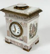 A French 19thc faience mantel clock with moulded top and ormolu mounted circular faience panel