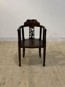 A Chinese style rosewood tub chair, floral carved splat back over panelled seat, raised on square